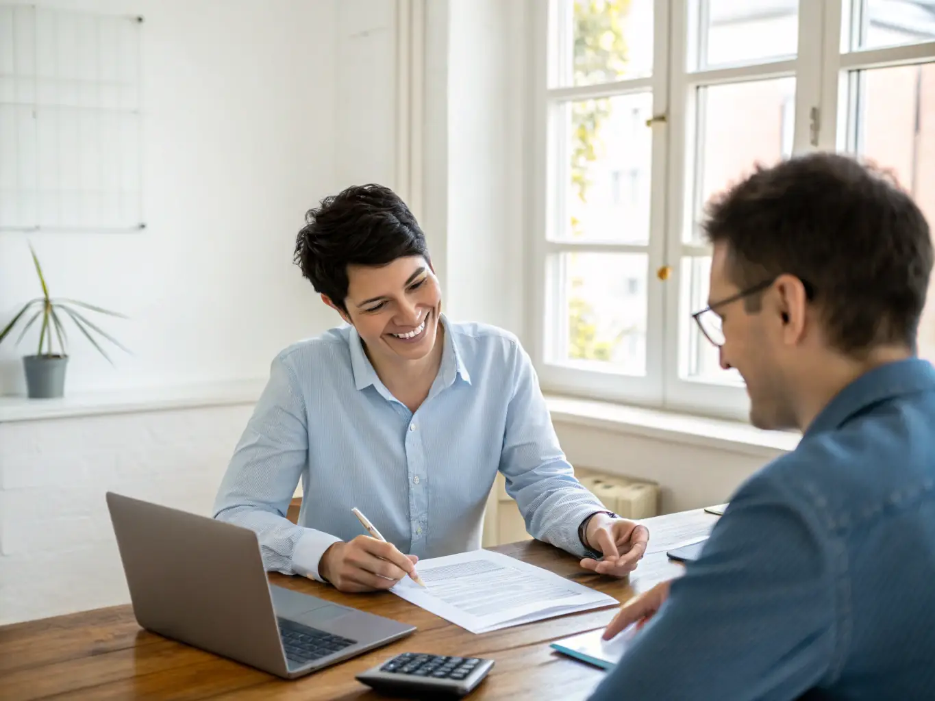 A professional discussing tax resolution options with a client in an office setting, illustrating tax restoration services.